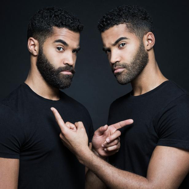 523006744 Studio shot of identical twin brothers